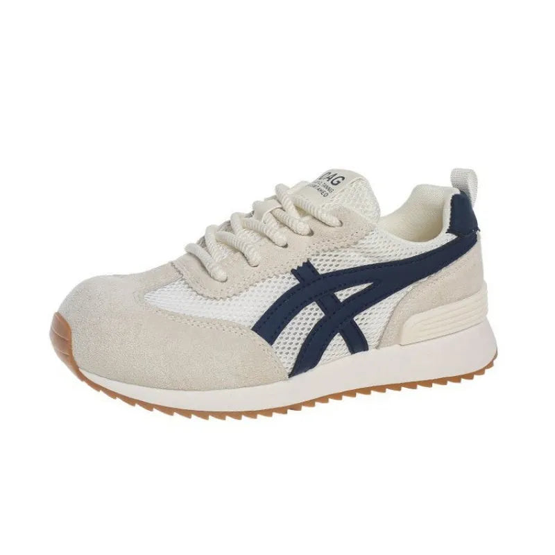 Women's white casual lace-up sneakers with round toe and non-slip sole on a plain background.