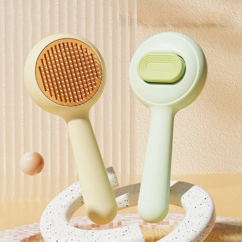 Green and yellow cat grooming brushes with stainless steel bristles and non-slip handles