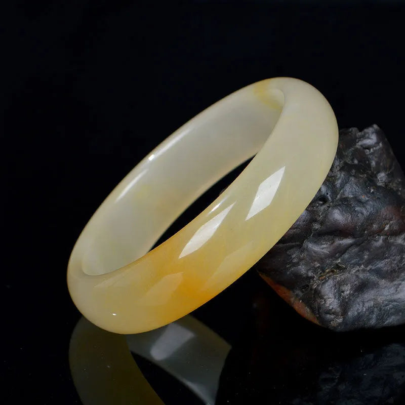 Natural light jade bracelet in traditional Chinese style with polished surface
