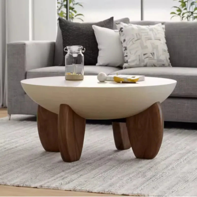 White solid wood coffee table with adjustable height and storage, set in a living room