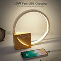 Navy blue touch control bedside lamp with digital alarm clock display and natural sounds functions.