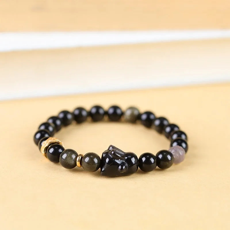 Handmade obsidian bracelet with lying rabbit charm in Jin Yaoshi and grey agate beads