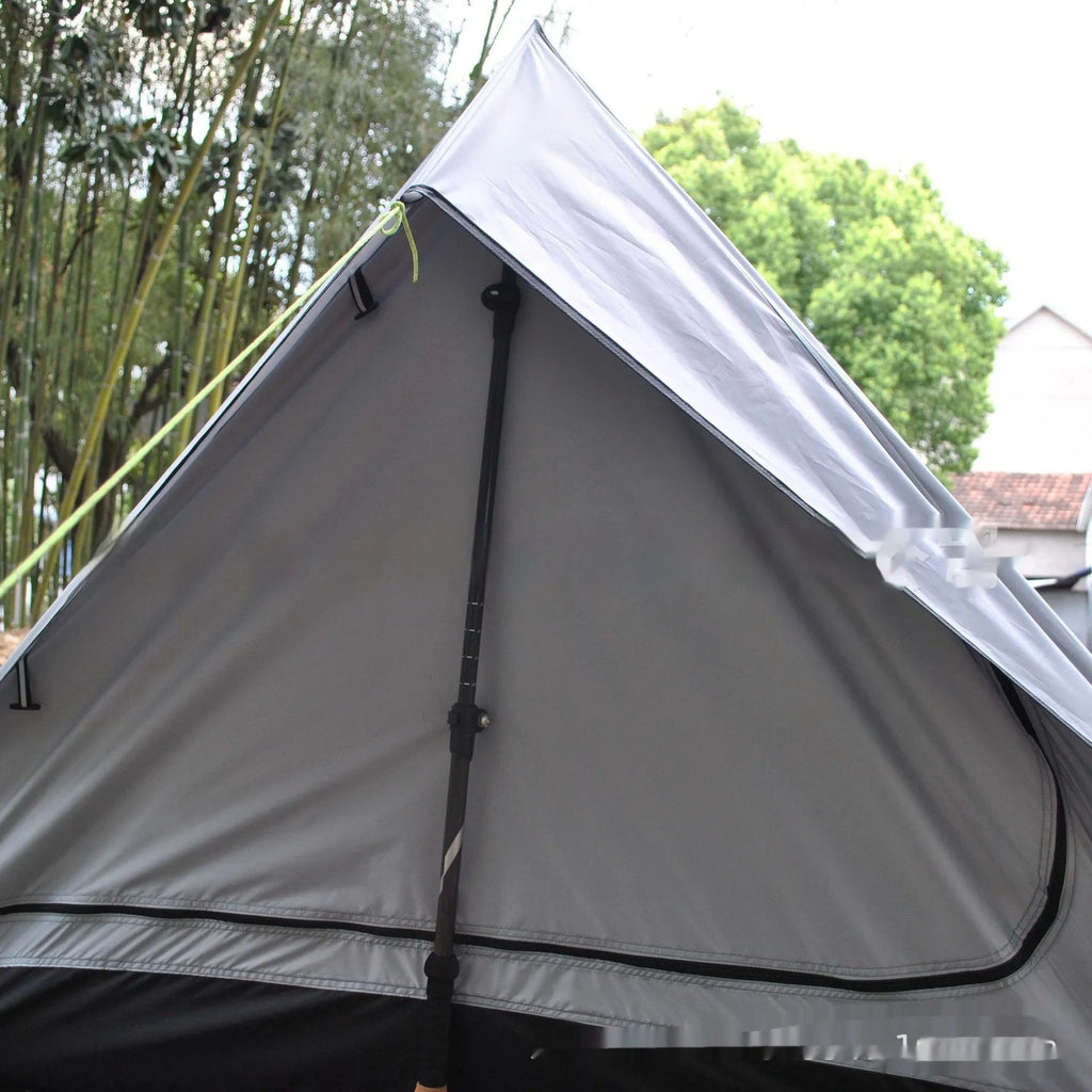 Brown A-line tent for 2-3 people with PU4000 waterproof fabric, 210x150x110cm, set in a grassy campsite.