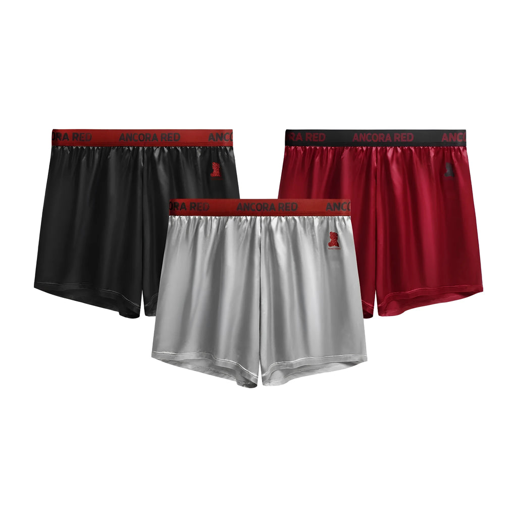 Solid colour men's polyester boxer briefs on a mid waist, shown in multiple colour options.