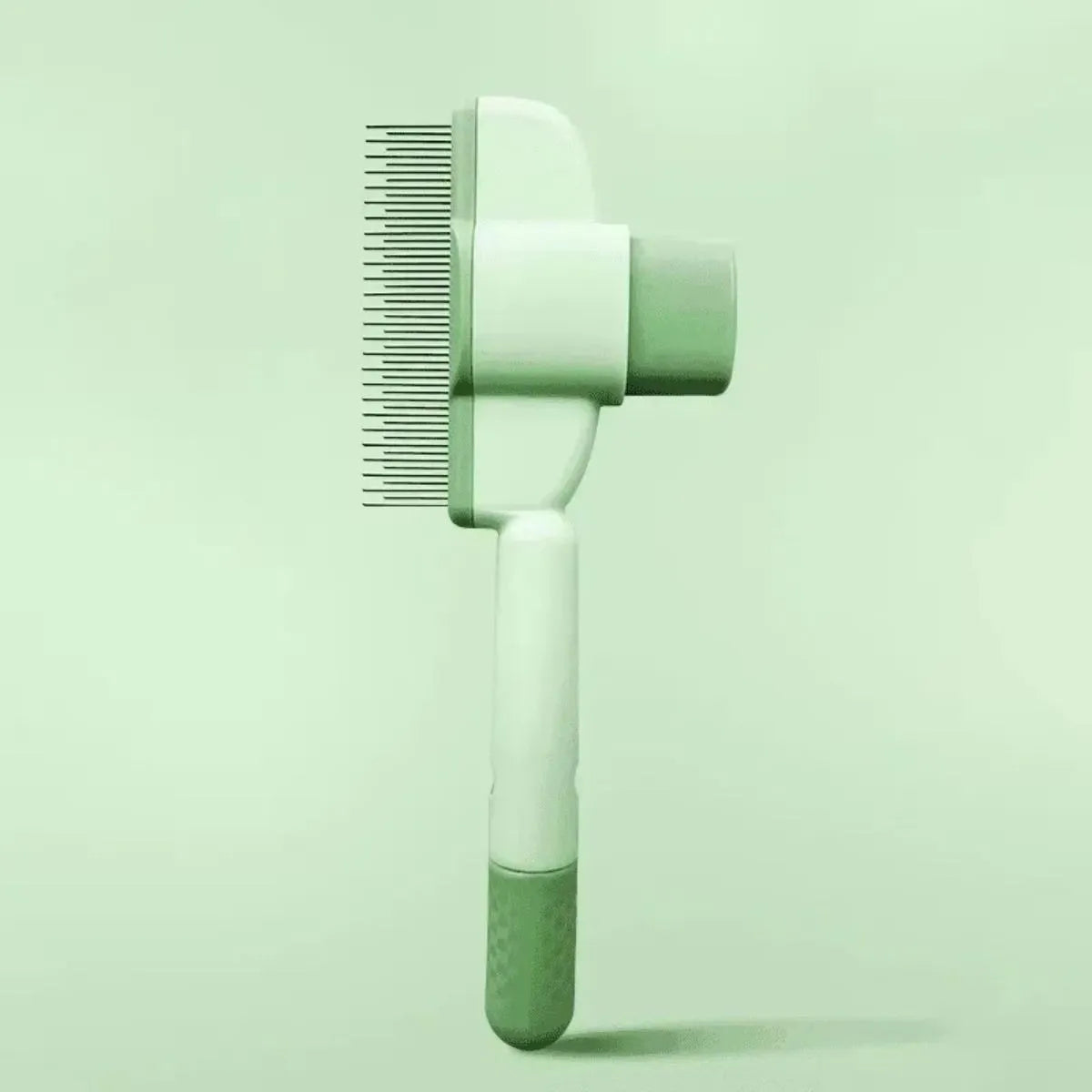 Green and yellow handheld dog grooming brush with one-click hair removal function.
