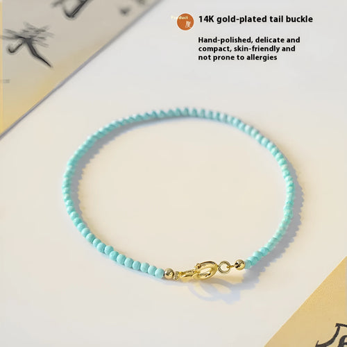 Close-up of a geometric bracelet made from small 2mm turquoise beads, shown in both raw and polished finishes, with a sizing chart for 14cm, 15cm, and 16cm wrists.