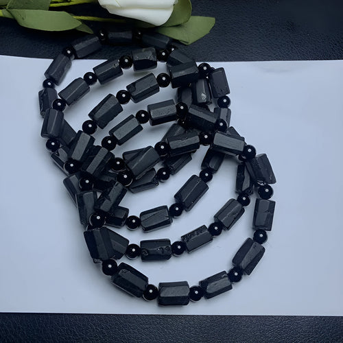 Black tourmaline rough stone bracelet with natural textured beads measuring 8.5-9mm and adjustable closure