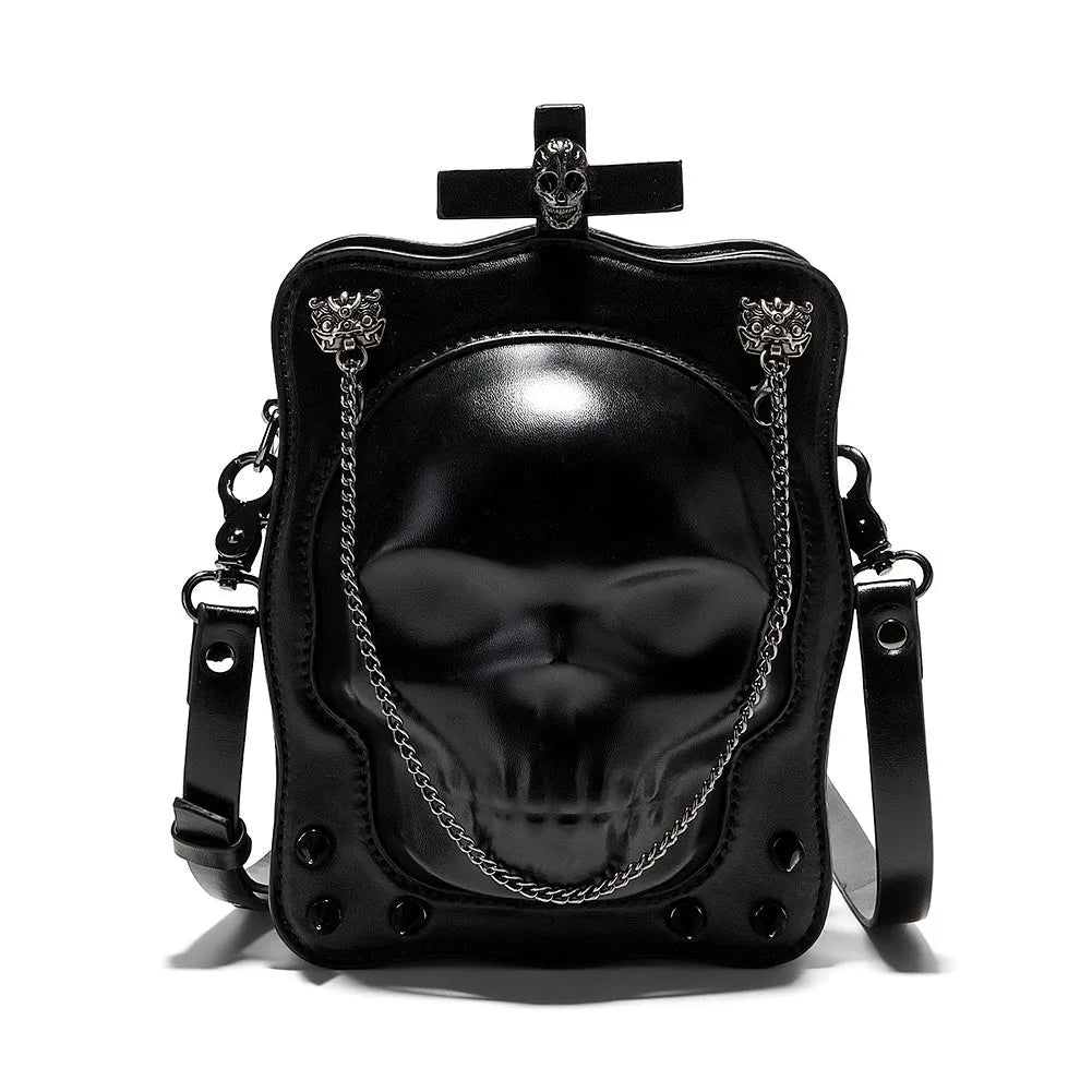 Black gothic crossbody bag with skull design, stitching, rivets, and chain details.
