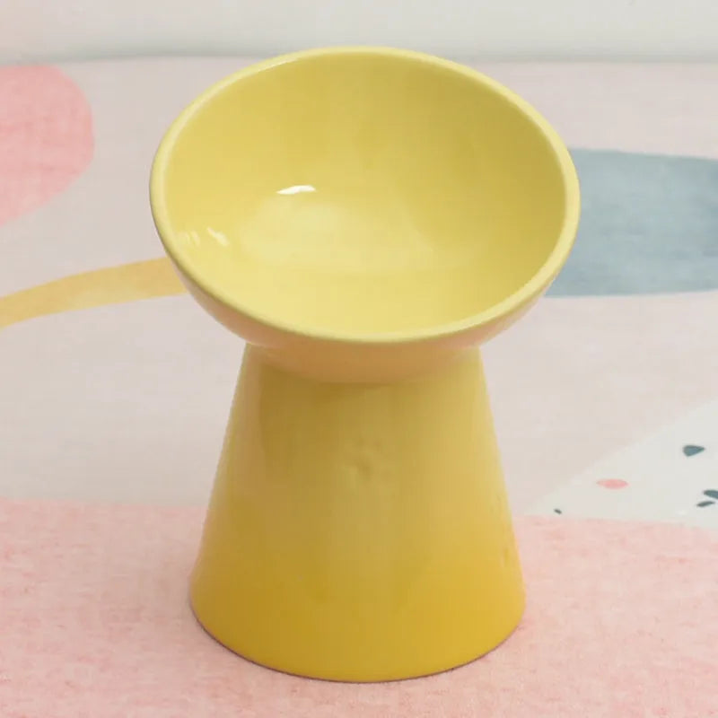 Black ceramic pet bowl with a high foot and neck protector to prevent tipping, shown with flat and slanted rim options.