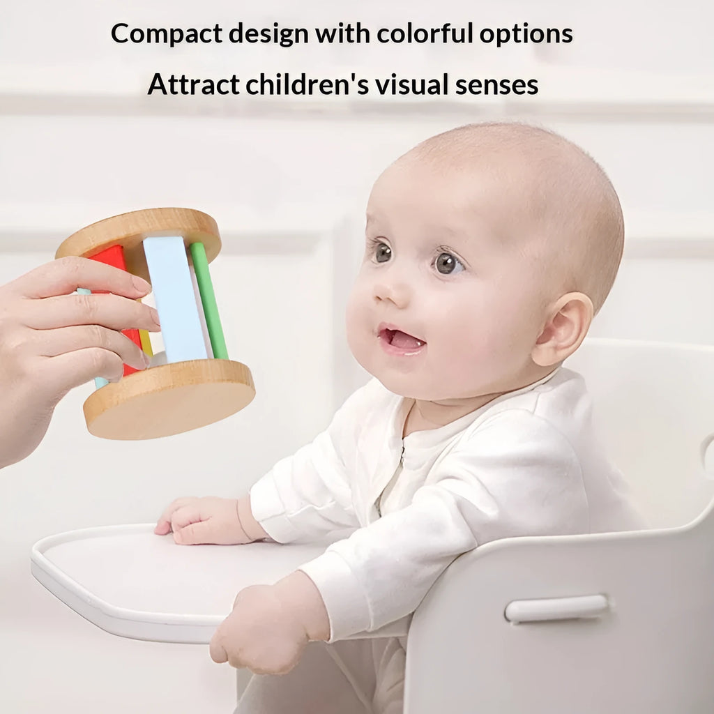 Wooden infant rainbow rattle with rainbow rolling bell, 7.5x7 cm size, on a white background
