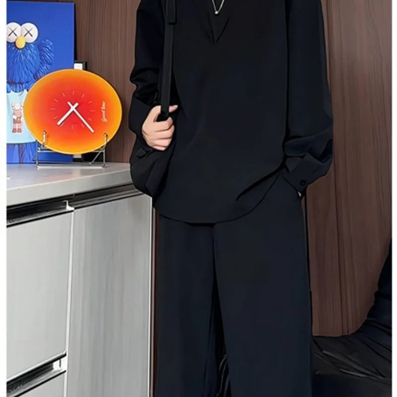 Men's black casual two-piece suit with long sleeve polo shirt and matching trousers in slim fit design