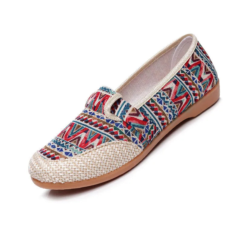 Women's flat heel ethnic cloth shoes in red, green, black, beige, or blue with colour stitching and a shallow mouth.