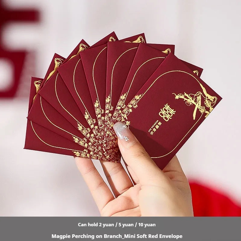 Pack of mini Chinese style wedding red packets in various colours for small cash gifts