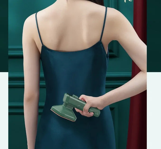 Dark green portable hanging steam ironing machine with ceramic panel.