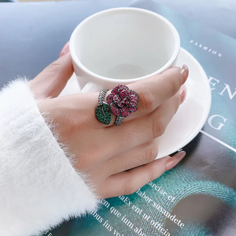 Gold-plated black gold geometric flower ring with simulation red corundum stones