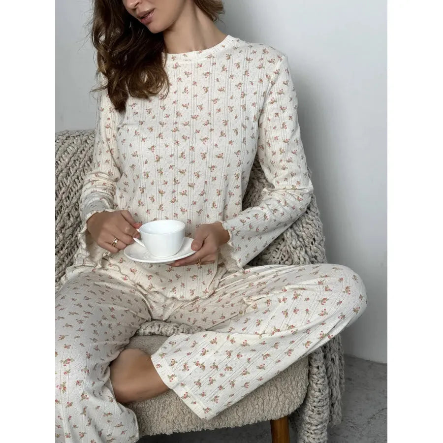 Women's white floral print bell sleeve round neck top and wide leg pants loungewear suit on model