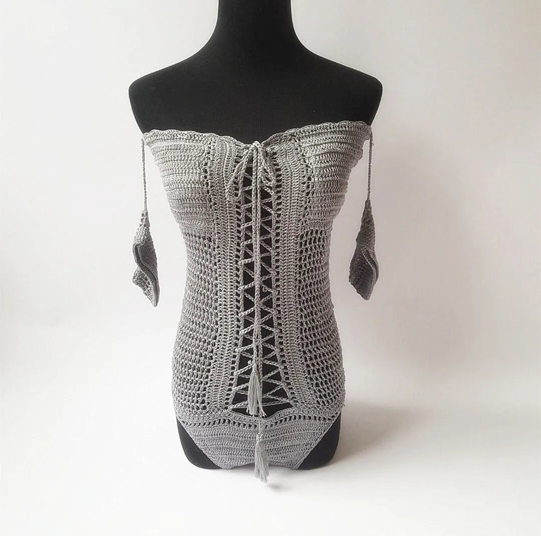 Off-shoulder one-piece swimsuit in light pink on a mannequin