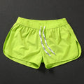 Men's loose fit elastic waist shorts in orange, green, or black for beach and surfing