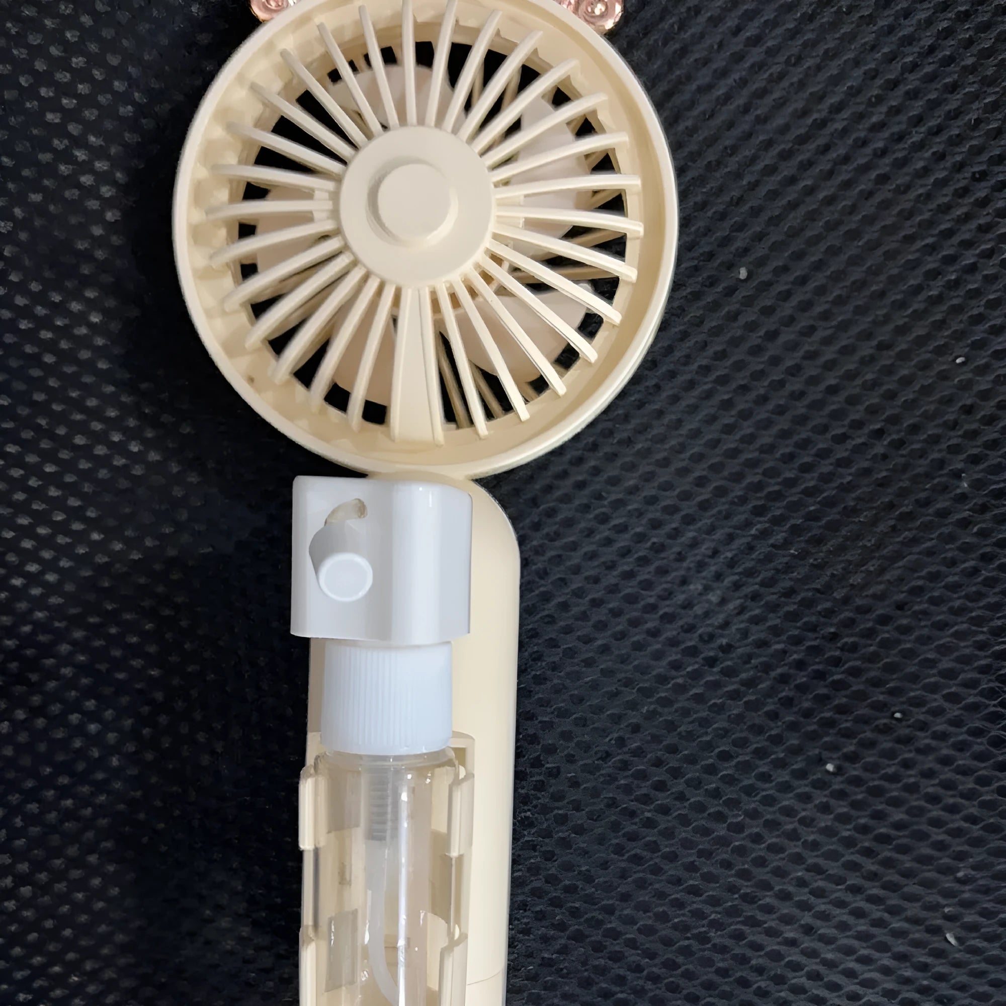 Plastic handheld USB rechargeable nozzle fan in apricot, blue, green, orange, or pink colour options.