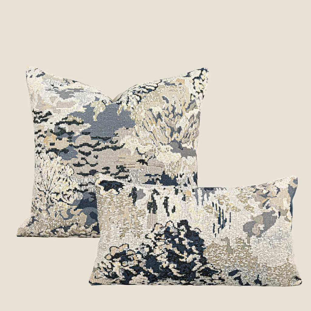 Antique blue wool-blended square throw pillow with abstract floral pattern on a neutral sofa