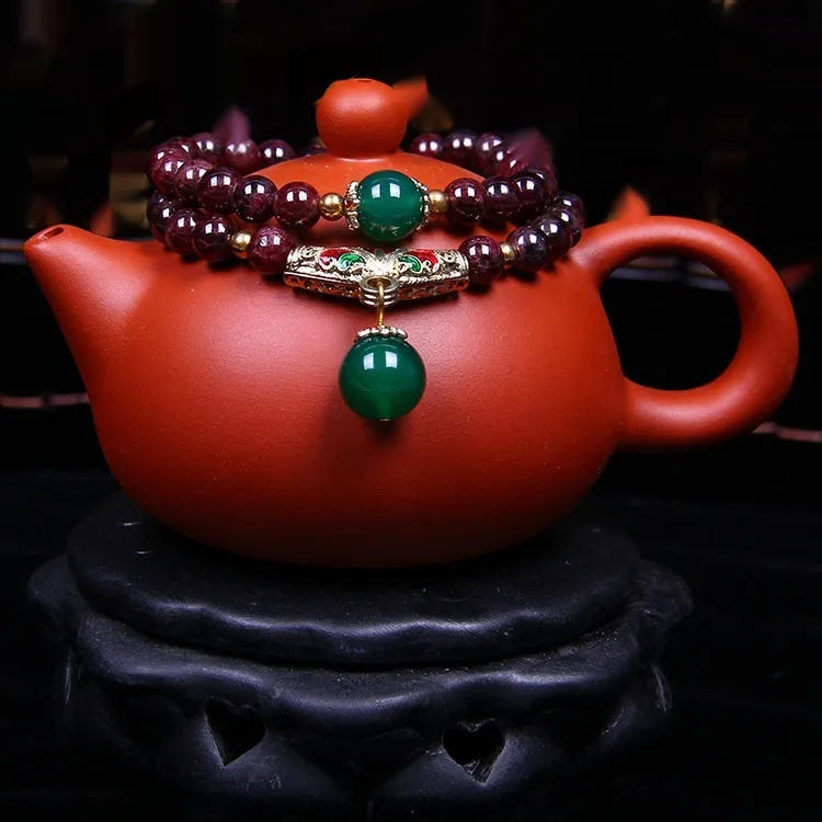 Natural garnet bracelet with 7mm beads, golden toad charm and adjustable double-ring clasp
