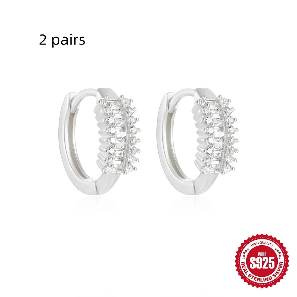 Small round geometric sterling silver stud earrings with diamond accents in gold or silver finish