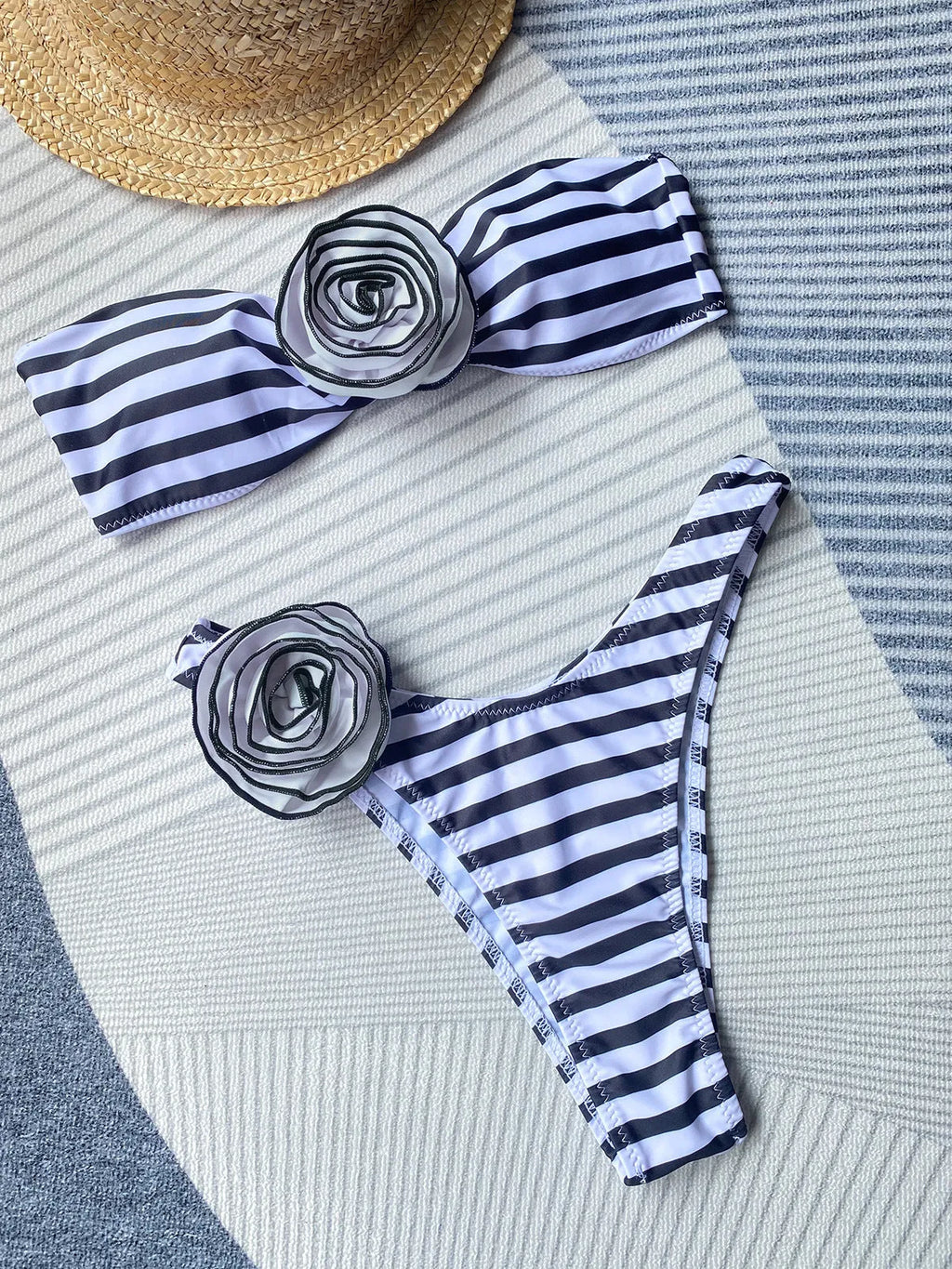 Women's striped tube top bikini with three-dimensional floral split detail on the shorts.