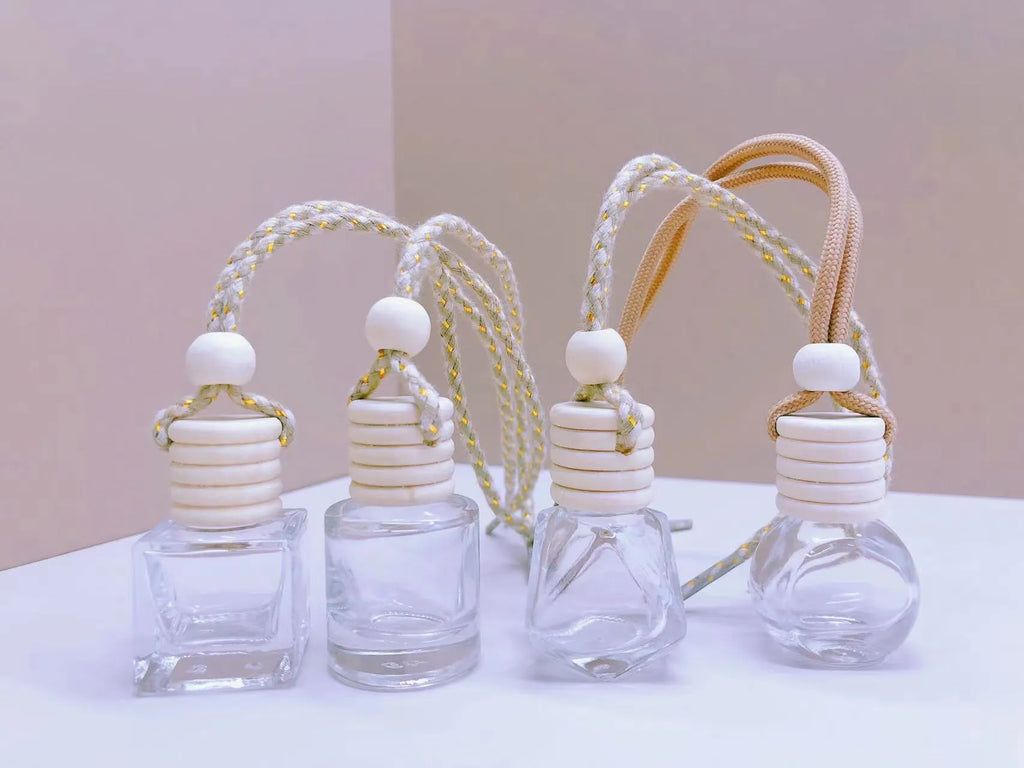 Glass car perfume pendant fragrance showing cylinder, diamond, flat drum and square container style options