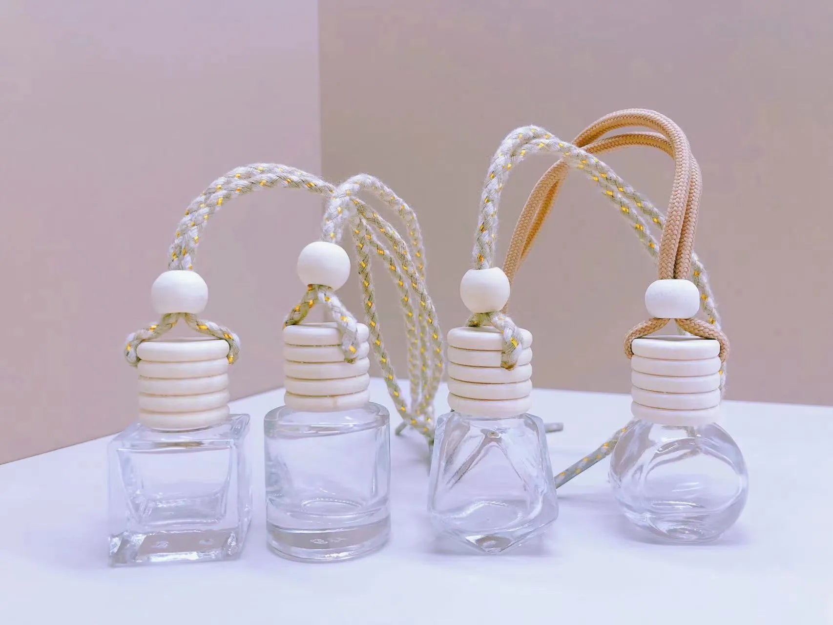 Glass car perfume pendant fragrance showing cylinder, diamond, flat drum and square container style options