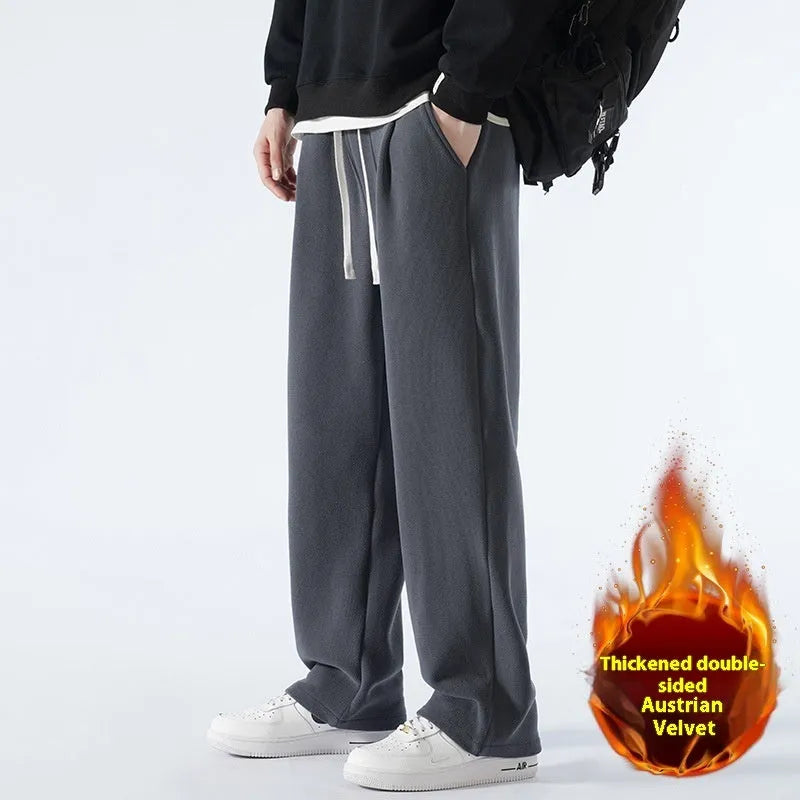 Man wearing apricot coloured loose-fit fleece-lined casual trousers with an elasticated waist.