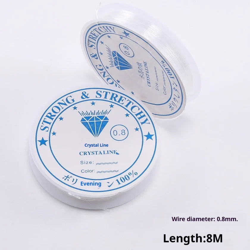 Coil of transparent white elastic fishing line cord for DIY jewellery and ornament making.