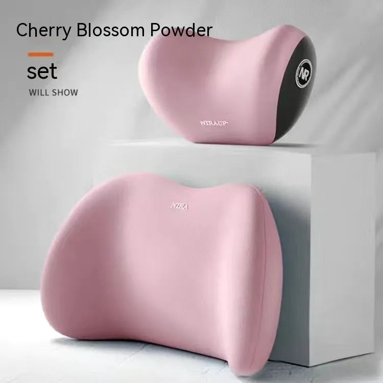 Black memory foam car lumbar support pillow and matching headrest pillow on a car seat.