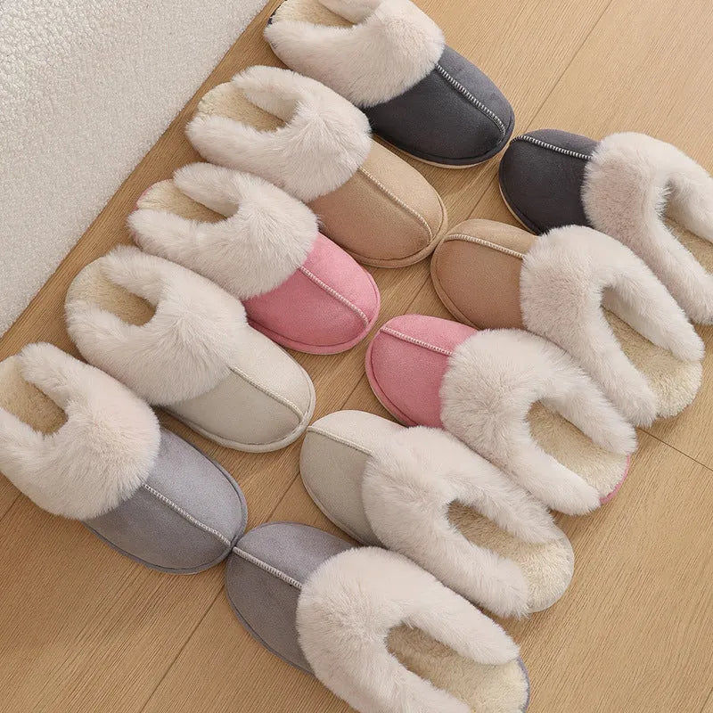 Brown plush indoor slippers with round toe, flat heel, and stitched detail on a PVC sole.