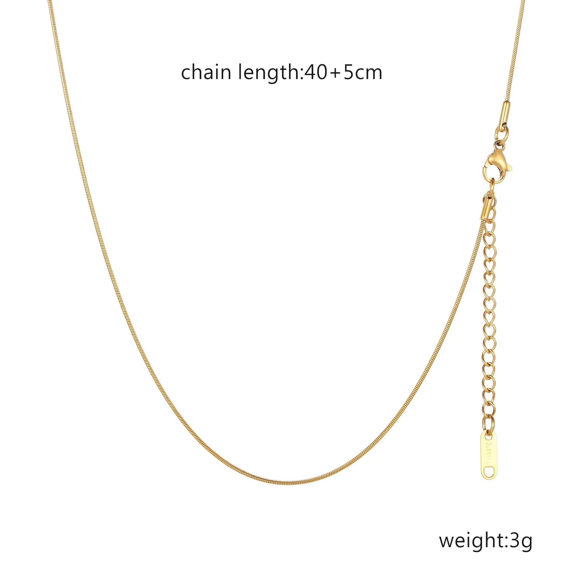 Women's stainless steel necklace with 18K gold hollow round pendant and O-link chain on neutral background