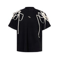 Black loose fit T-shirt with rivet ribbon padded shoulder detailing and short sleeves