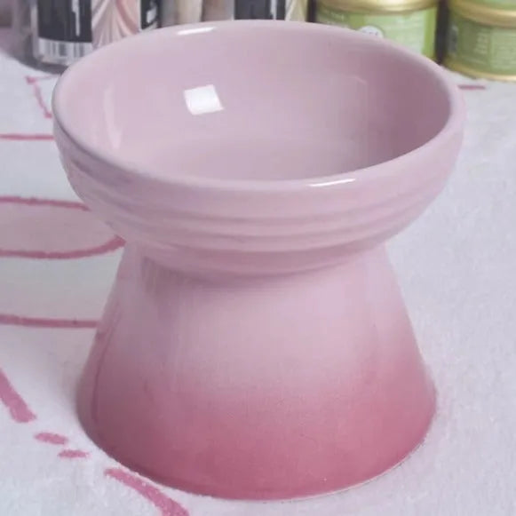 Black ceramic pet bowl with a high foot and neck protector to prevent tipping, shown with flat and slanted rim options.