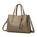 Genuine cowhide leather women's handbag in horizontal square shape with shoulder strap and organisational compartments
