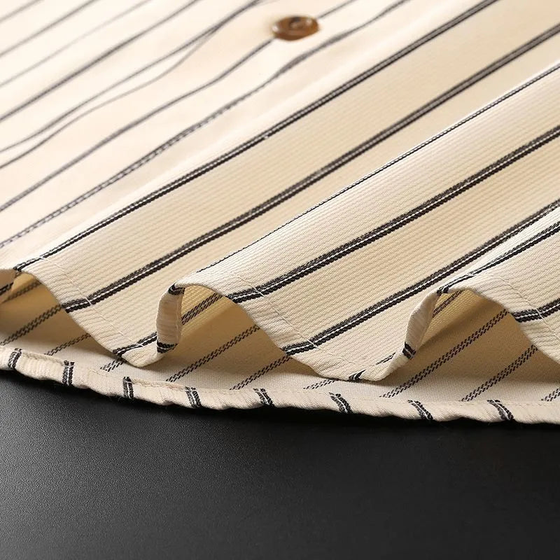 Coffee coloured striped men's long-sleeved shirt with slim fit on a hanger.
