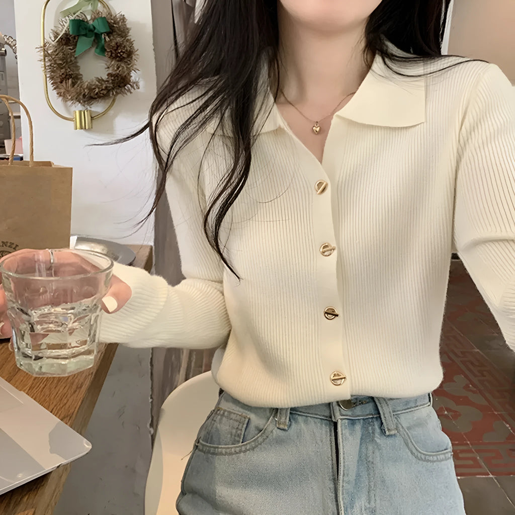 Loose fit long sleeve viscose knitted cardigan in beige, shown worn open.