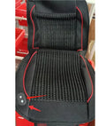 Black car ventilation seat cushion with power cord, shown on a car seat