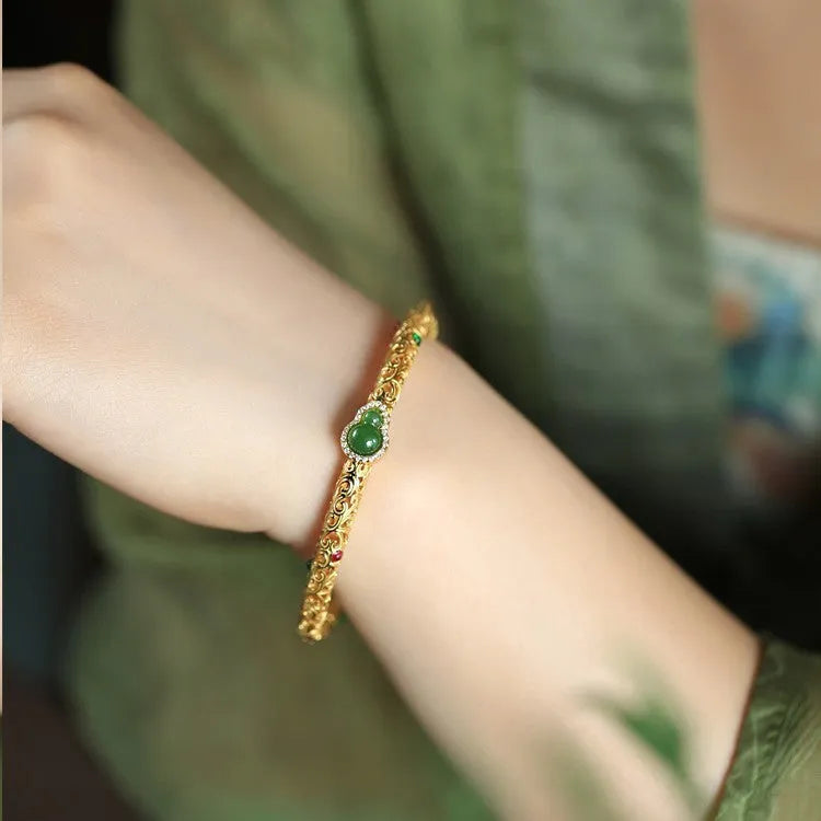 Women's gold-plated silk bracelet with adjustable knot and traditional Chinese xiangyun gourd charm