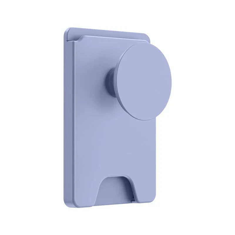 Minimalist black magnetic suction phone holder for iPhone on a desk.