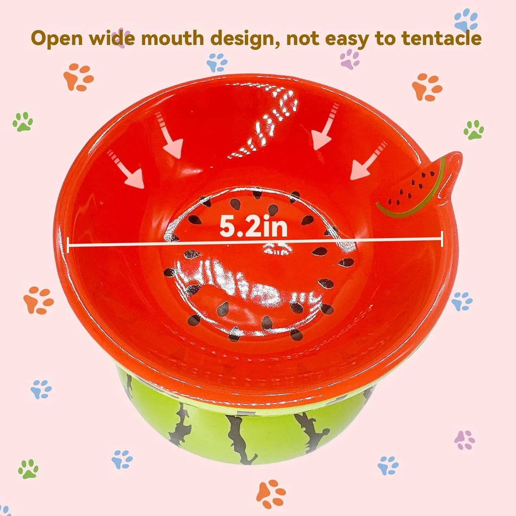 Ceramic elevated cat bowl with tilted orange fruit pattern and non-slip base.