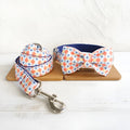 Dog bow collar in Lantern colour with attached bow and traction rope, polyester construction, size options XS to XL