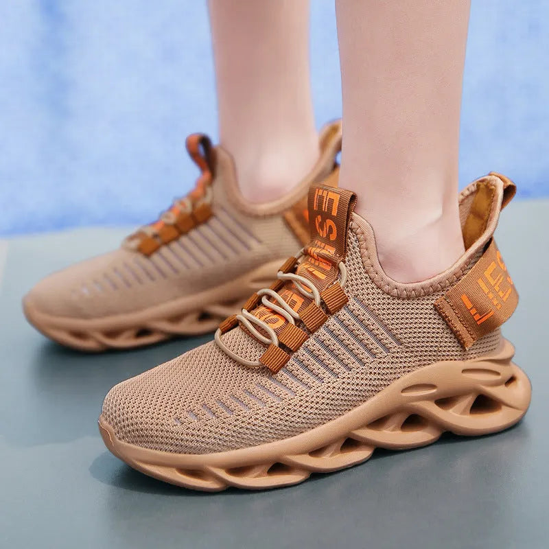 Kids casual black fabric sneakers with Velcro strap and lightweight EVA sole.