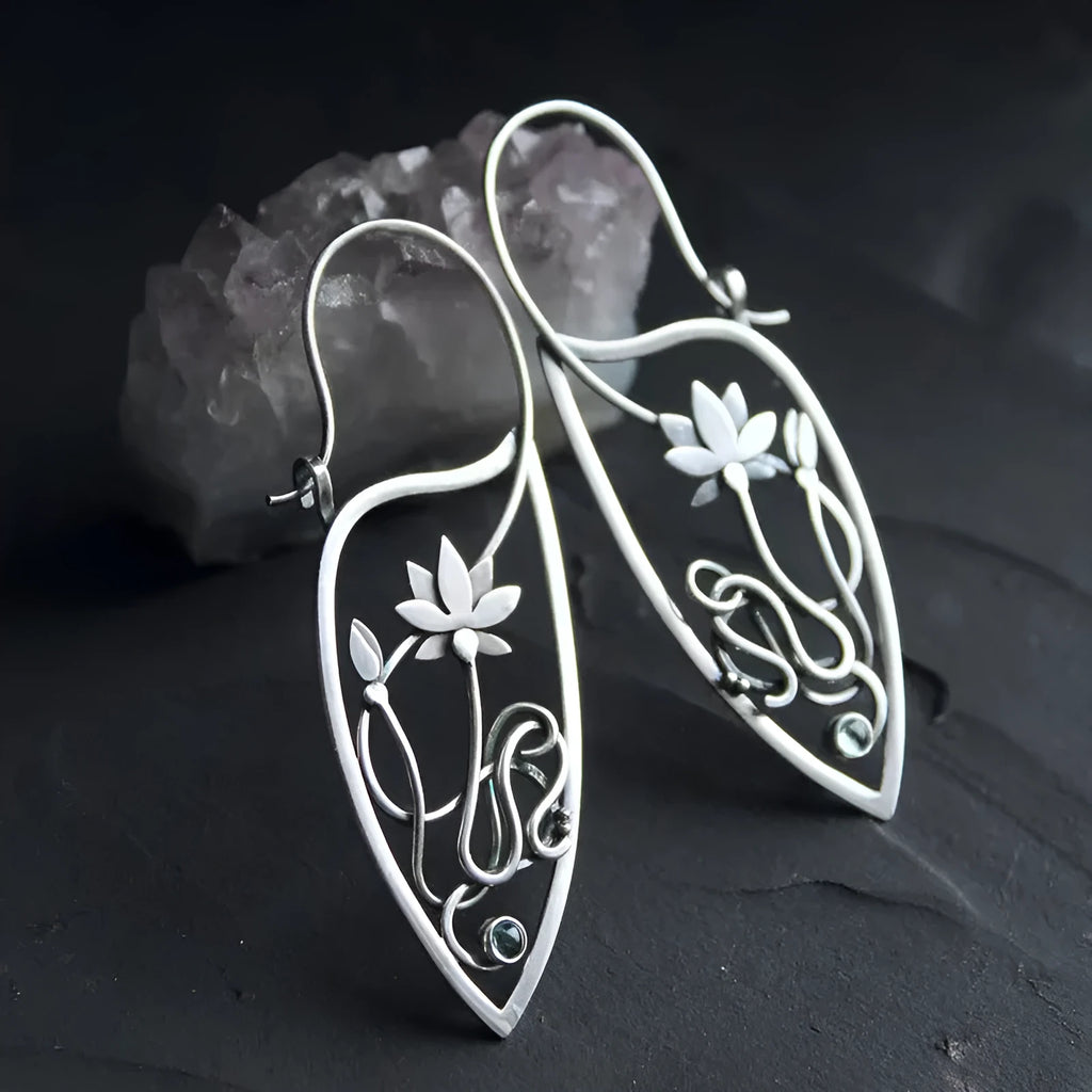Silver women's earrings with lotus vine design featuring geometric floral patterns and circular rhinestones