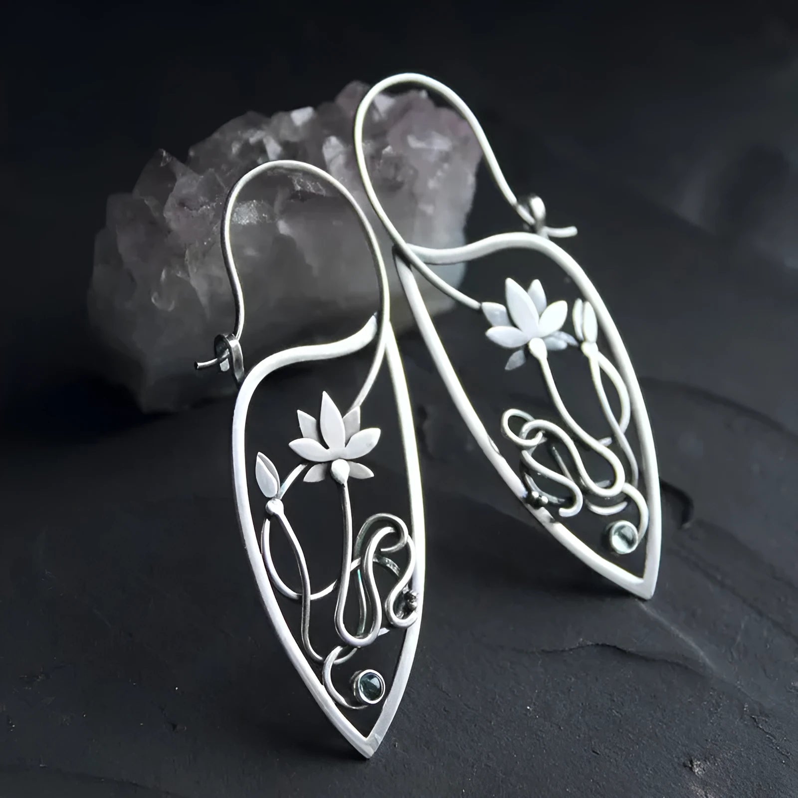 Silver women's earrings with lotus vine design featuring geometric floral patterns and circular rhinestones