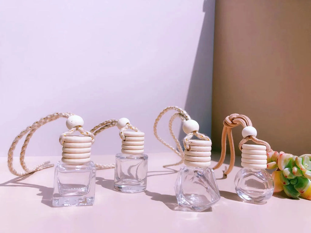Glass car perfume pendant fragrance showing cylinder, diamond, flat drum and square container style options