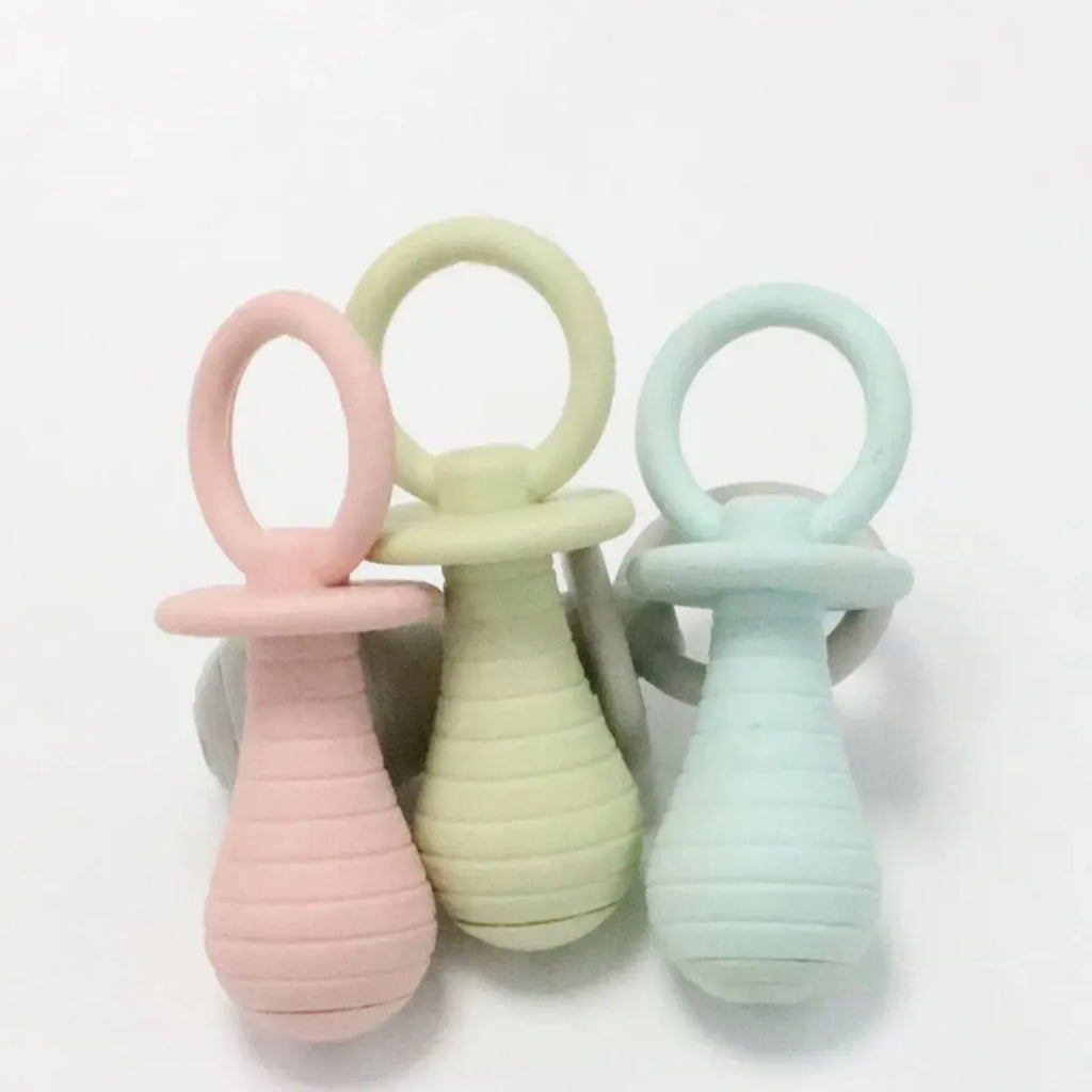 Four coloured pet pacifier rubber chew toys with squeakers for puppies and kittens