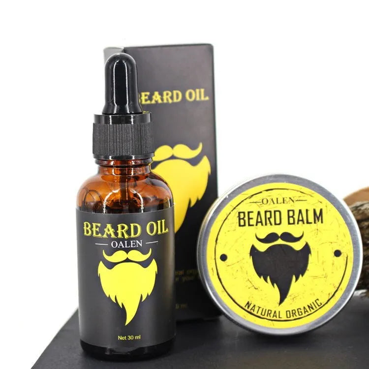 six-piece beard care kit with beard cream, beard oil, peach wood comb, bristle brush, stainless steel scissors, and linen bag on a wooden surface
